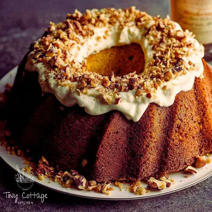 bicardi rum cake recipe, topped with nuts, baked in a bundt pan